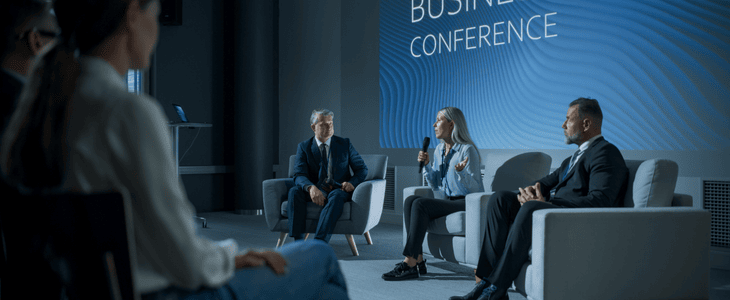 Group of professionals gather to a keynote panel